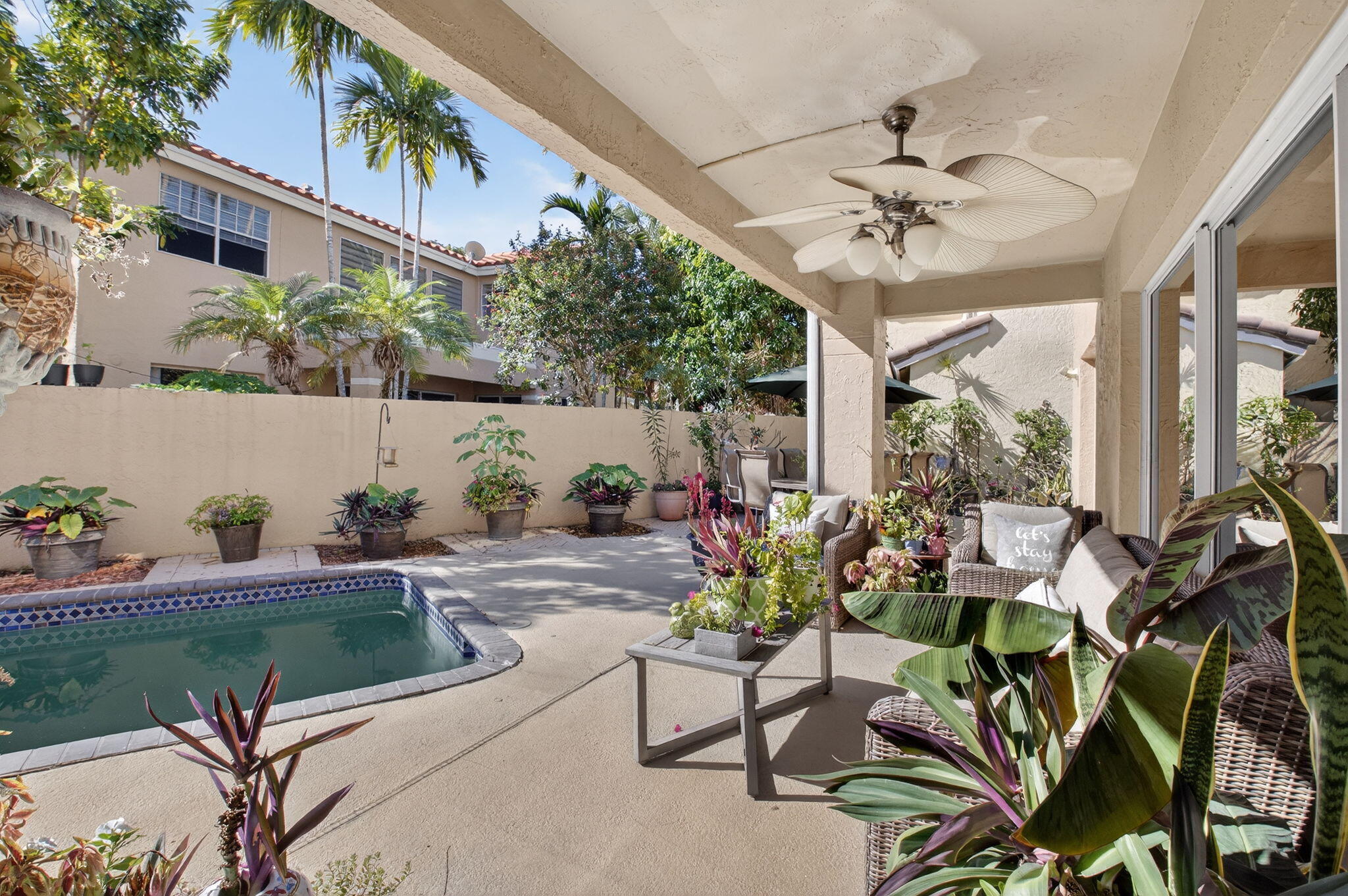 10570 Bexley Boulevard Boca Raton, FL 33428 - Photo 21 of 37 a view of a chairs and table in a patio