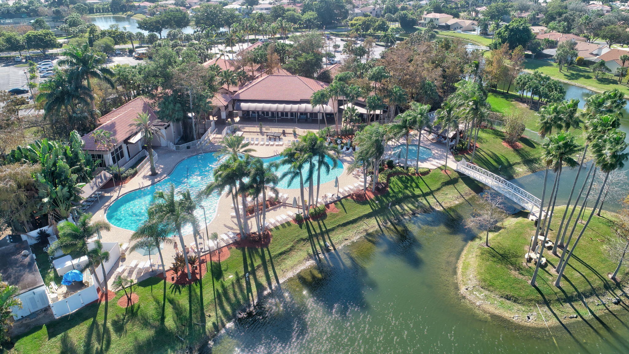 10570 Bexley Boulevard Boca Raton, FL 33428 - Photo 27 of 37 an aerial view of residential houses with outdoor space and trees
