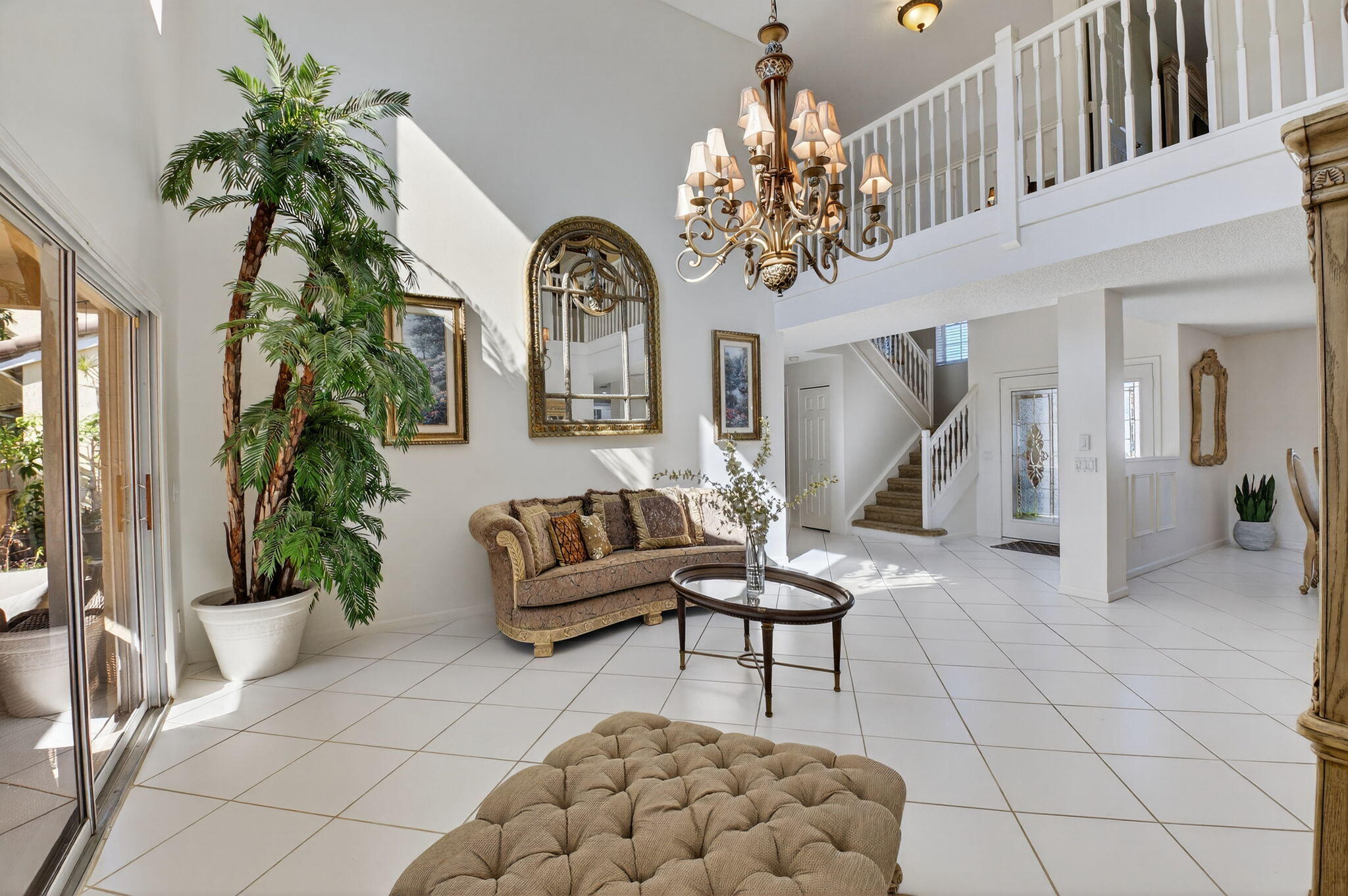 10570 Bexley Boulevard Boca Raton, FL 33428 - Photo 5 of 37 a living room with furniture and a chandelier
