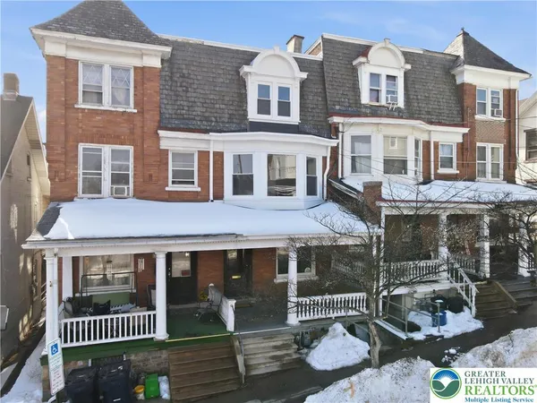 a front view of a building with street view and glass windows