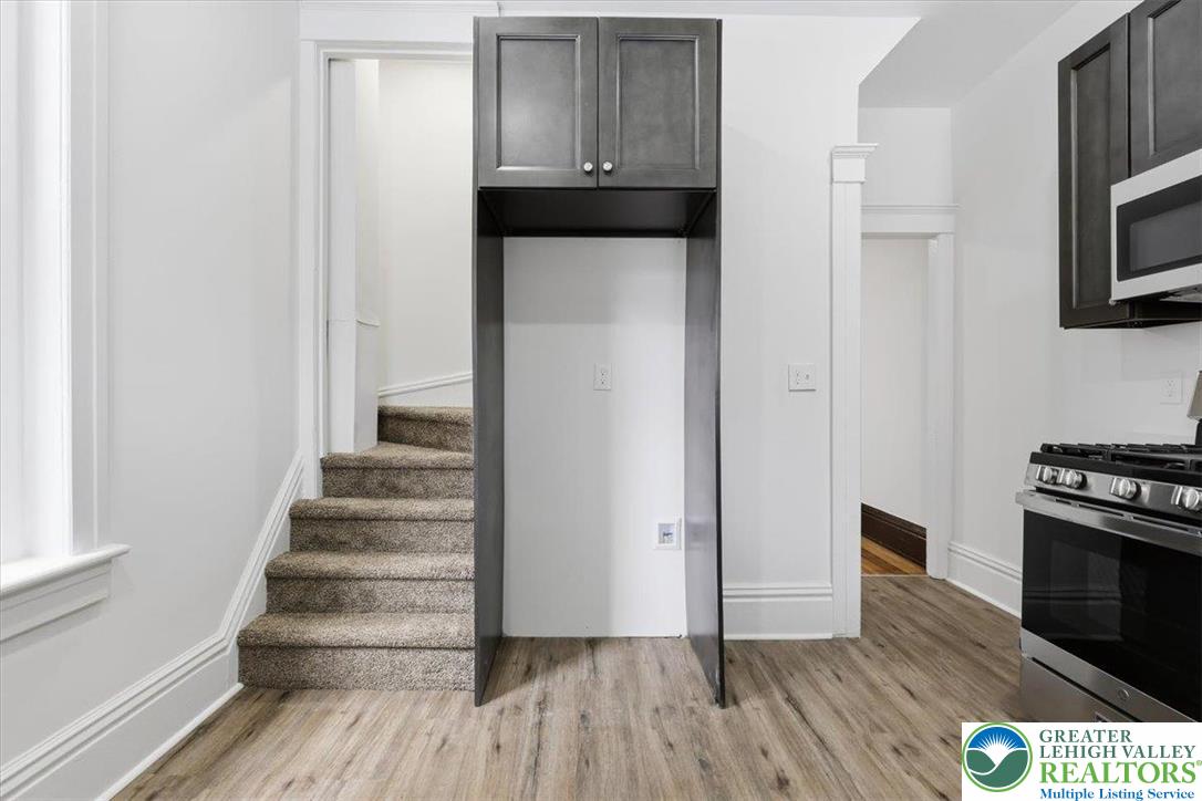 524 Fiot Street Bethlehem, PA 18015 - Photo 15 of 42 a view of a hallway with wooden floor and staircase