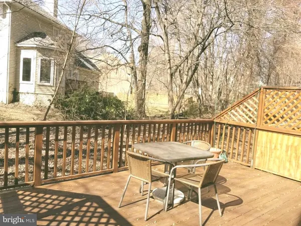 a view of a balcony with wooden floor
