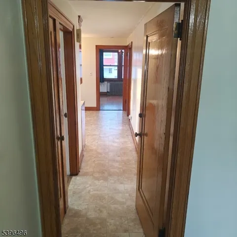 a view of a bathroom from a corridor