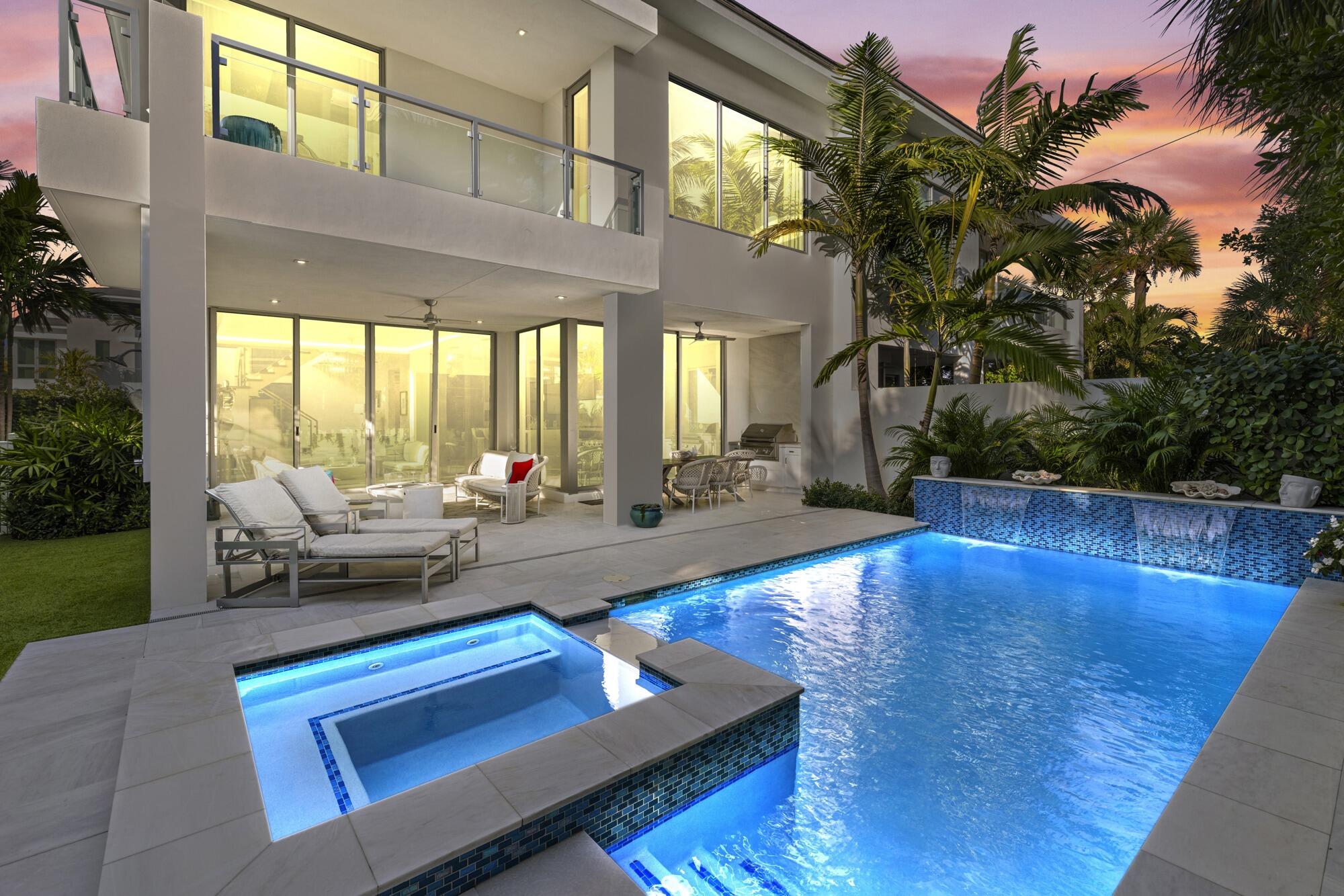 402 Ocean One Lane Juno Beach, FL 33408 - Photo 1 of 45 a living room with patio furniture and a wooden floor