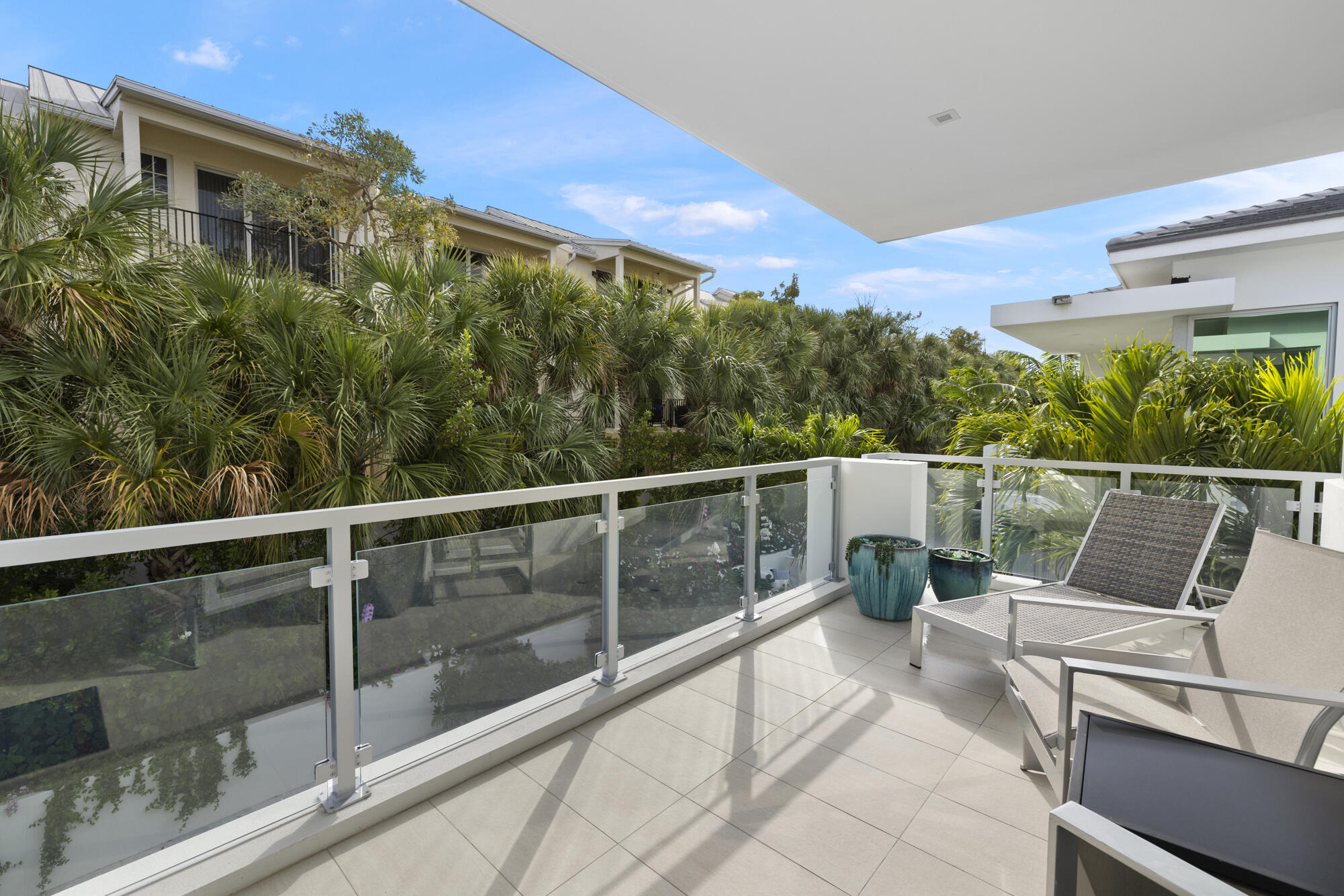 402 Ocean One Lane Juno Beach, FL 33408 - Photo 18 of 45 a view of a balcony with chairs