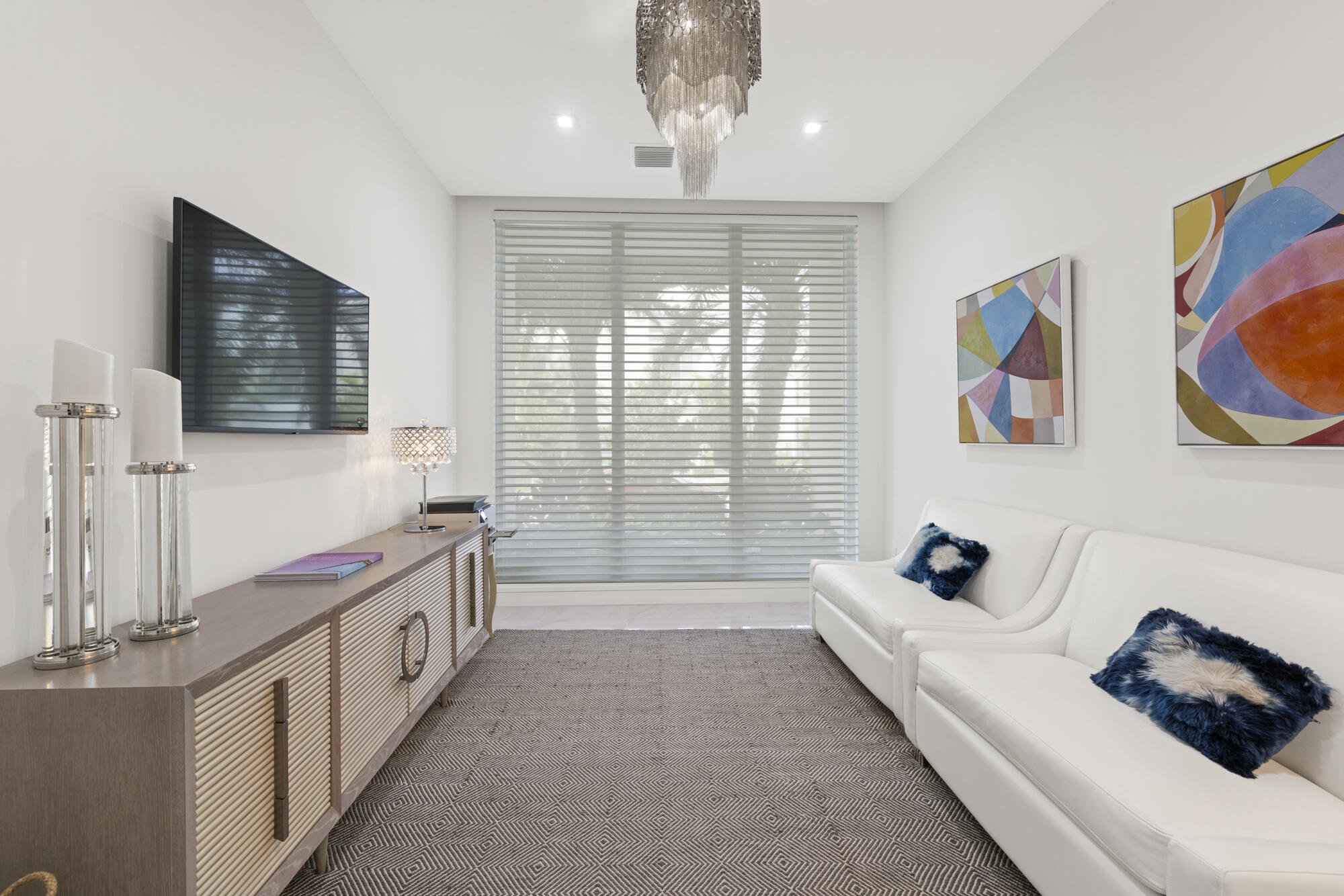 402 Ocean One Lane Juno Beach, FL 33408 - Photo 24 of 45 a spacious bedroom with a bed and a couch