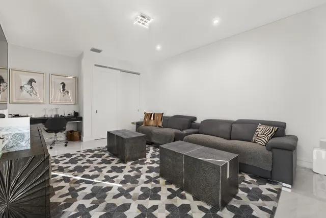 a living room with furniture and a rug