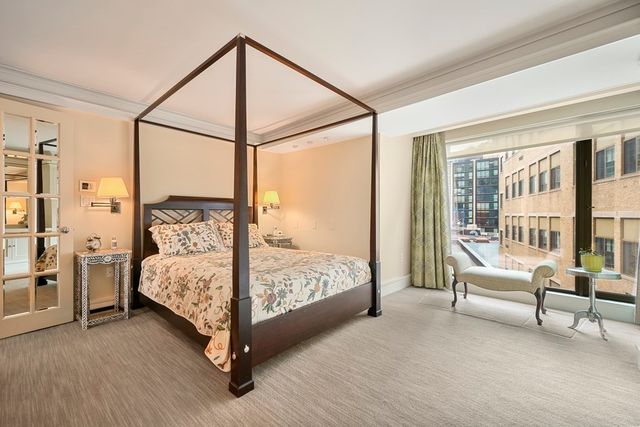 a bedroom with a bed and a view of bedroom