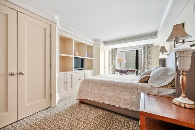 a bedroom with bed and window