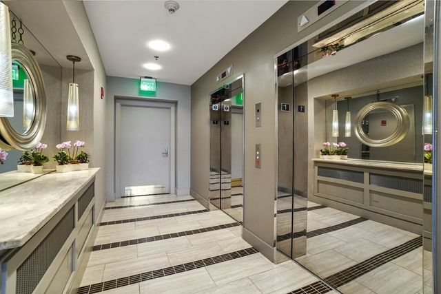 a spacious bathroom with a double vanity sink and a mirror
