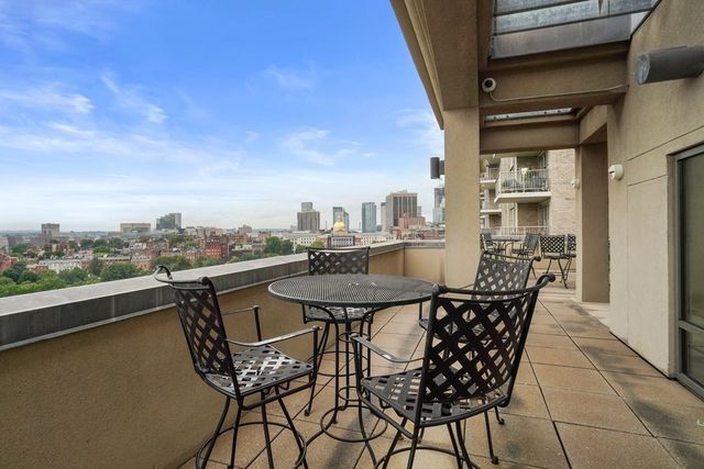 a view of a terrace with furniture and stove