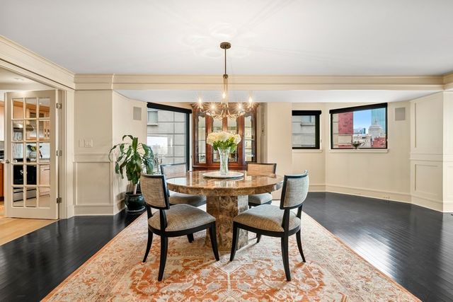 a dining room with furniture window wooden floor