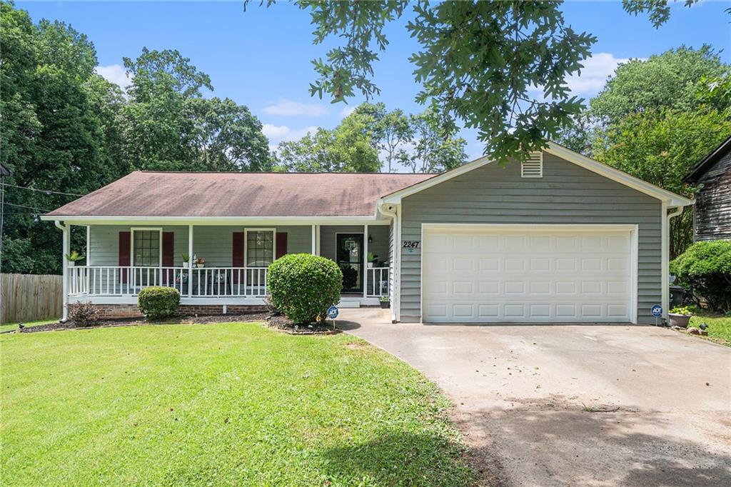 a front view of house with yard and outdoor seating