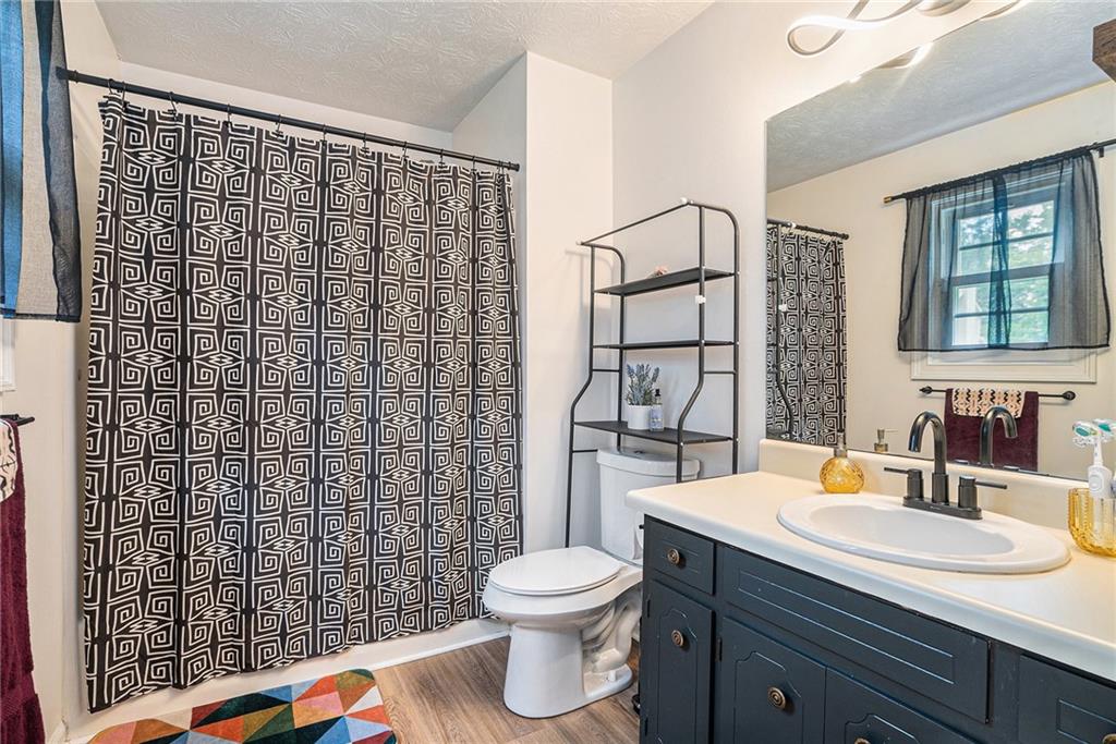 2247 Cruse Road Northwest Lawrenceville, GA 30044 - Photo 13 of 16 a bathroom with a sink toilet and shower