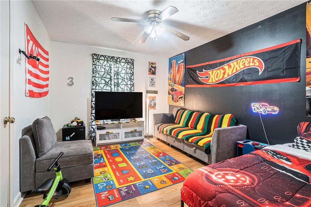 2247 Cruse Road Northwest Lawrenceville, GA 30044 - Photo 8 of 16 a living room with two couch and a flat screen tv