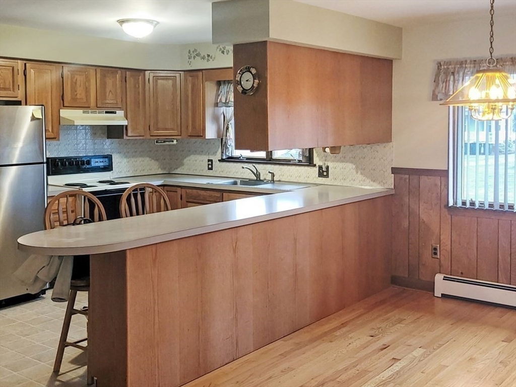 125 George Street Somerset, MA 02726 - Photo 5 of 9 a kitchen with a sink a window and cabinets