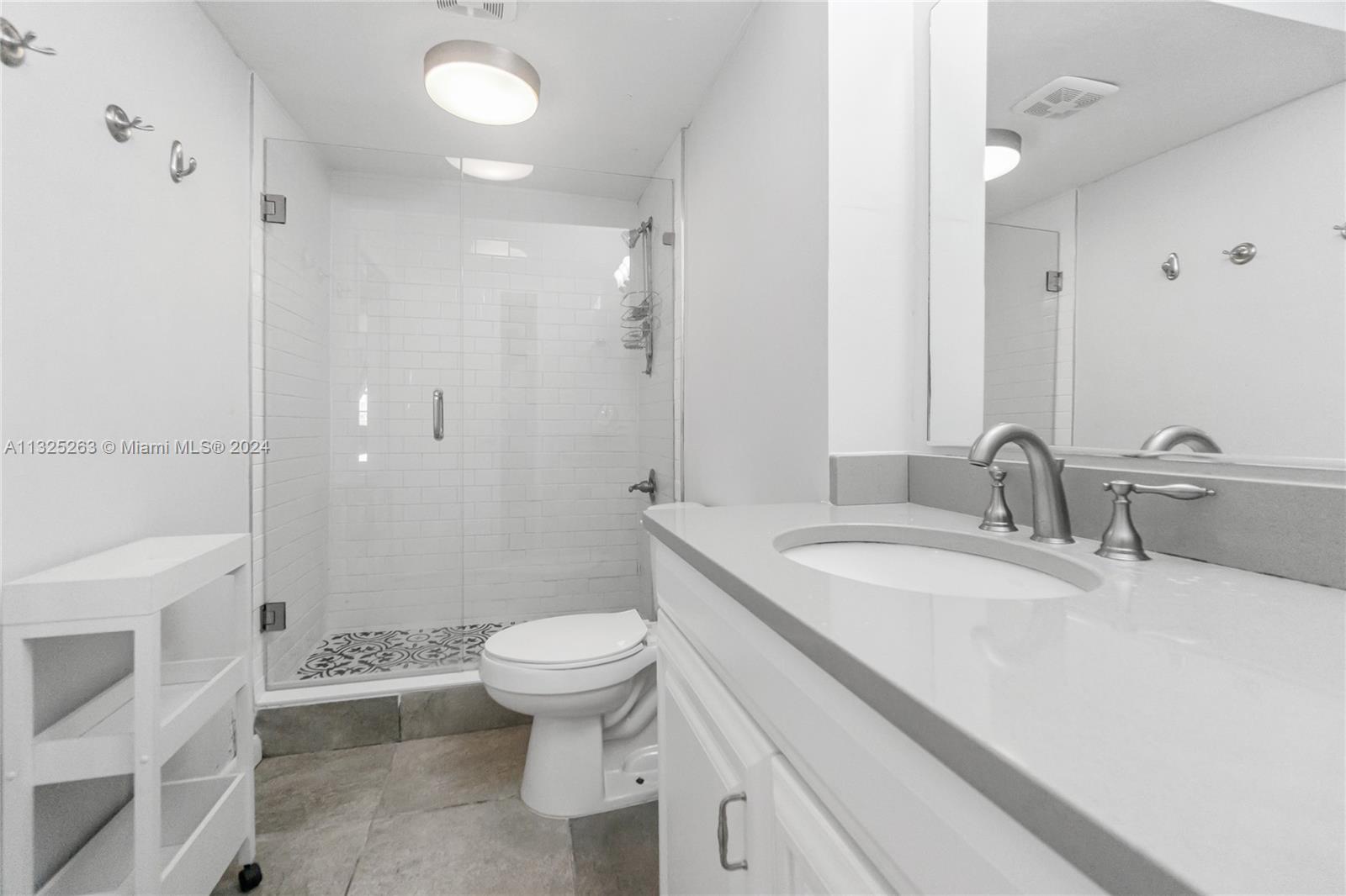 100 Lincoln Road, Unit 320 Miami Beach, FL 33139 - Photo 10 of 23 a bathroom with a sink toilet double vanity and shower
