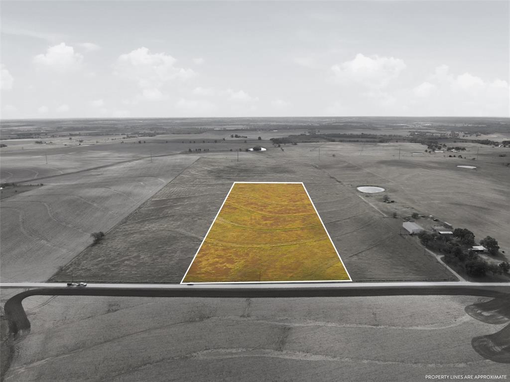 a view of swimming pool with outdoor seating and yard in back