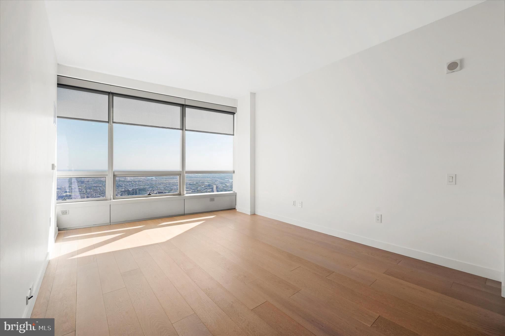 2930 Walnut Street, Unit 3613 Philadelphia, PA 19104 - Photo 14 of 33 an empty room with wooden floor and windows