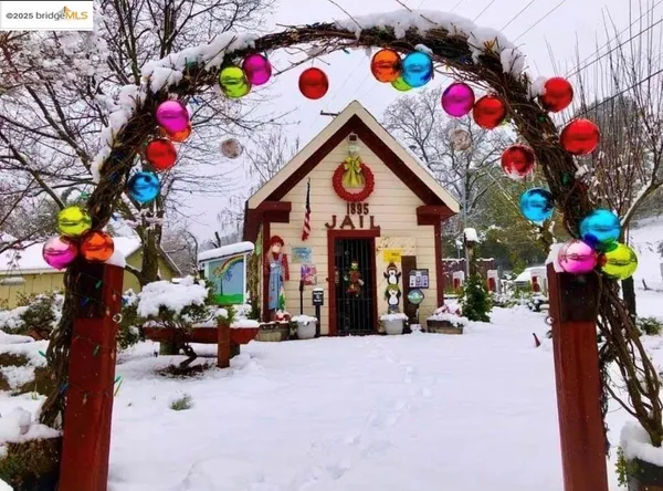 a view of a park with iron fence
