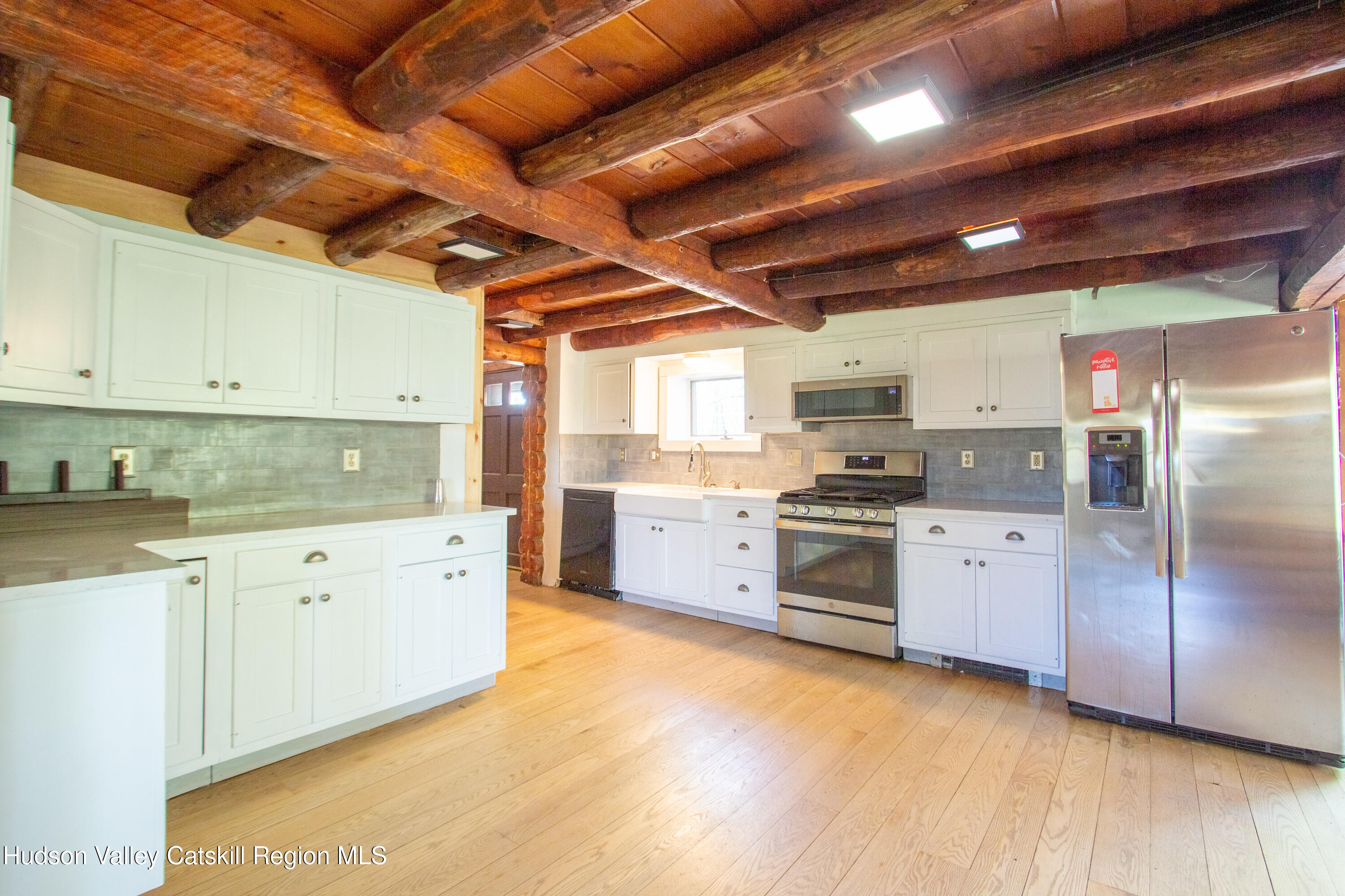205 Fordham Road Valatie, NY 12184 - Photo 4 of 18 a kitchen with granite countertop wooden floors a sink and stainless steel appliances