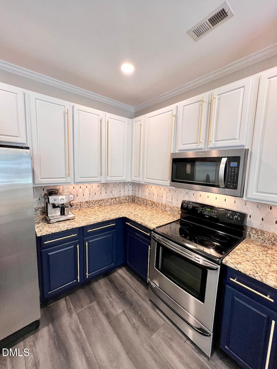 1941 Lost Lane Raleigh, NC 27603 - Photo 12 of 25 a kitchen with granite countertop a sink cabinets and stainless steel appliances