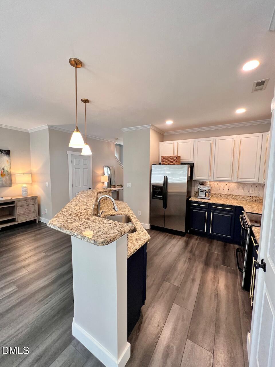 1941 Lost Lane Raleigh, NC 27603 - Photo 13 of 25 a kitchen with stainless steel appliances granite countertop a sink stove and refrigerator