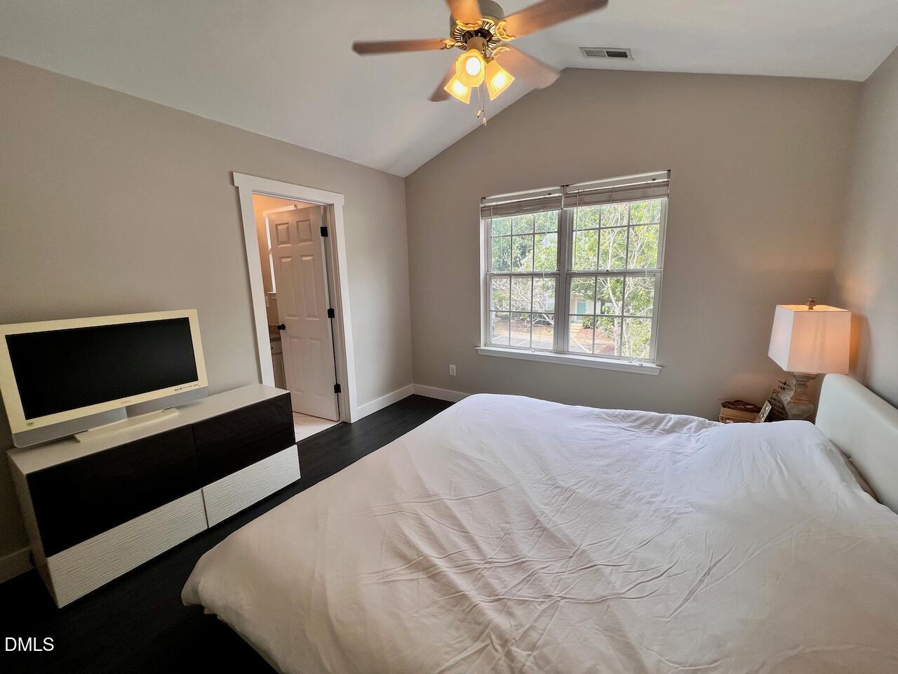 1941 Lost Lane Raleigh, NC 27603 - Photo 15 of 25 a bedroom with a bed and a window