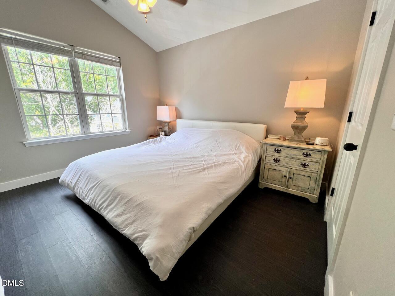 1941 Lost Lane Raleigh, NC 27603 - Photo 16 of 25 a bedroom with a bed and a window