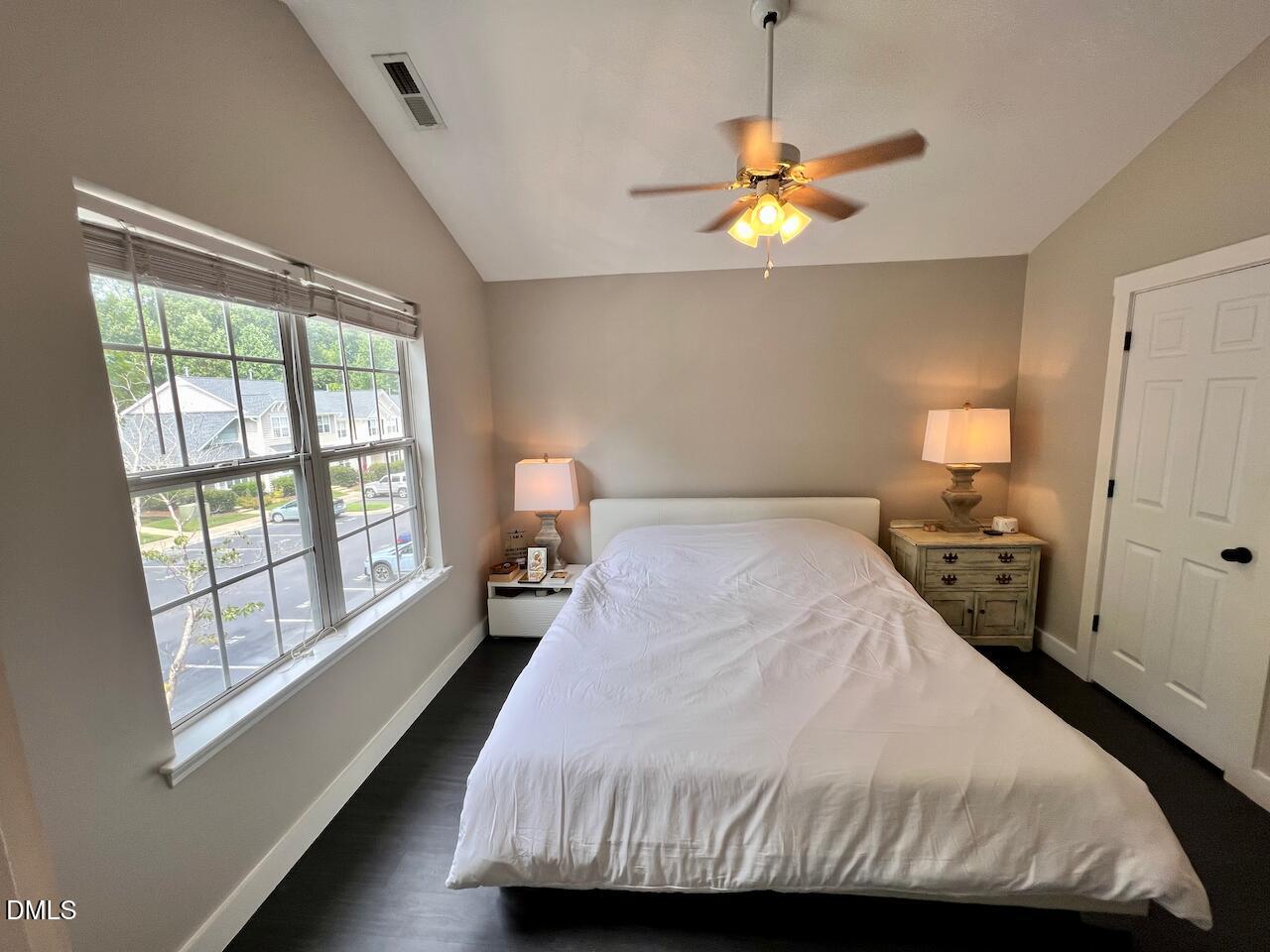 1941 Lost Lane Raleigh, NC 27603 - Photo 17 of 25 a bedroom with a bed and a window