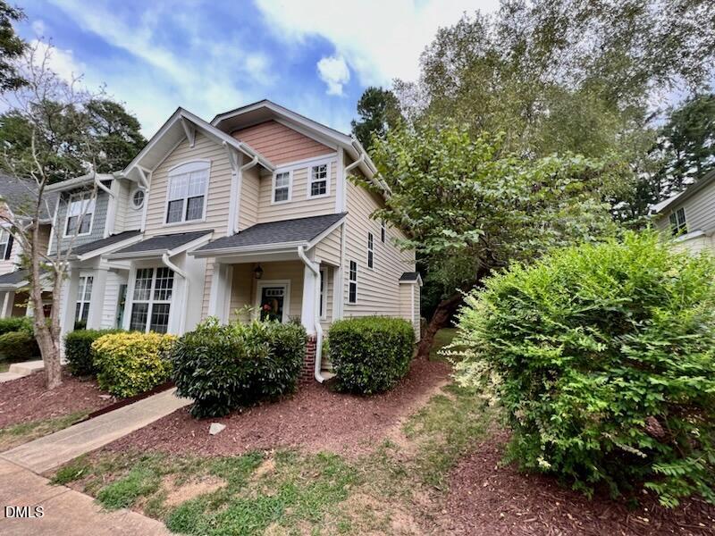 1941 Lost Lane Raleigh, NC 27603 - Photo 2 of 25 a front view of a house with a yard and trees