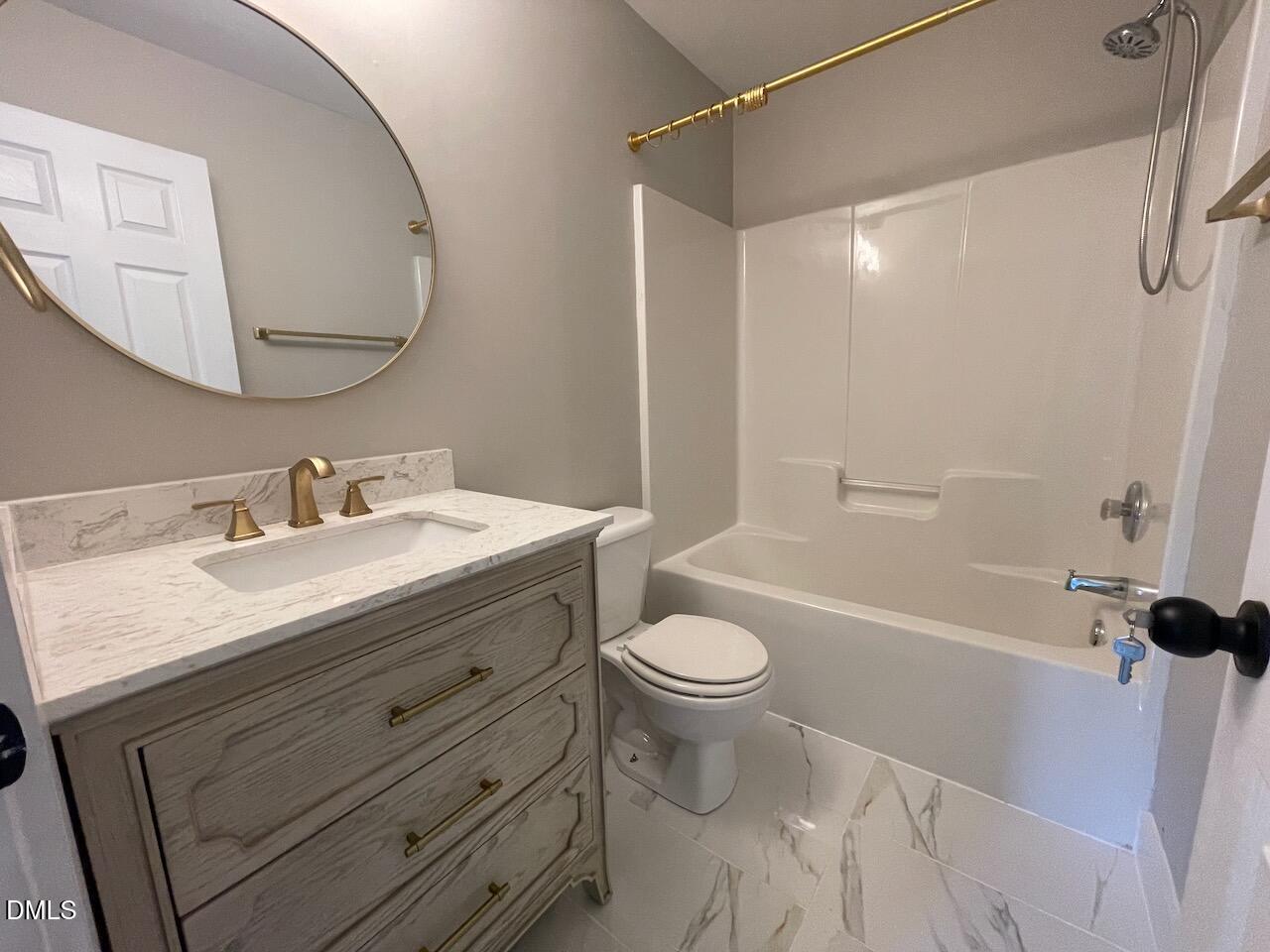 1941 Lost Lane Raleigh, NC 27603 - Photo 21 of 25 a bathroom with a sink toilet a shower and a mirror