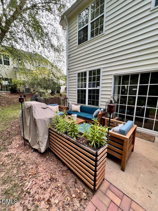 1941 Lost Lane Raleigh, NC 27603 - Photo 25 of 25 a backyard of a house with barbeque oven and outdoor seating