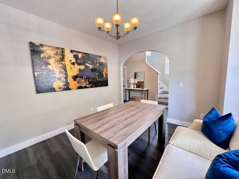 1941 Lost Lane Raleigh, NC 27603 - Photo 4 of 25 a view of a dining room with furniture and wooden floor