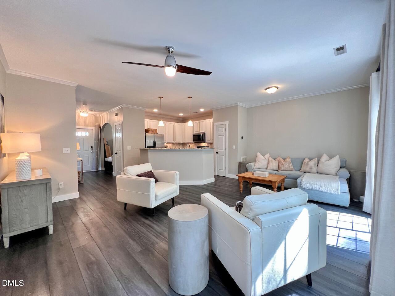 1941 Lost Lane Raleigh, NC 27603 - Photo 5 of 25 a living room with furniture and a wooden floor