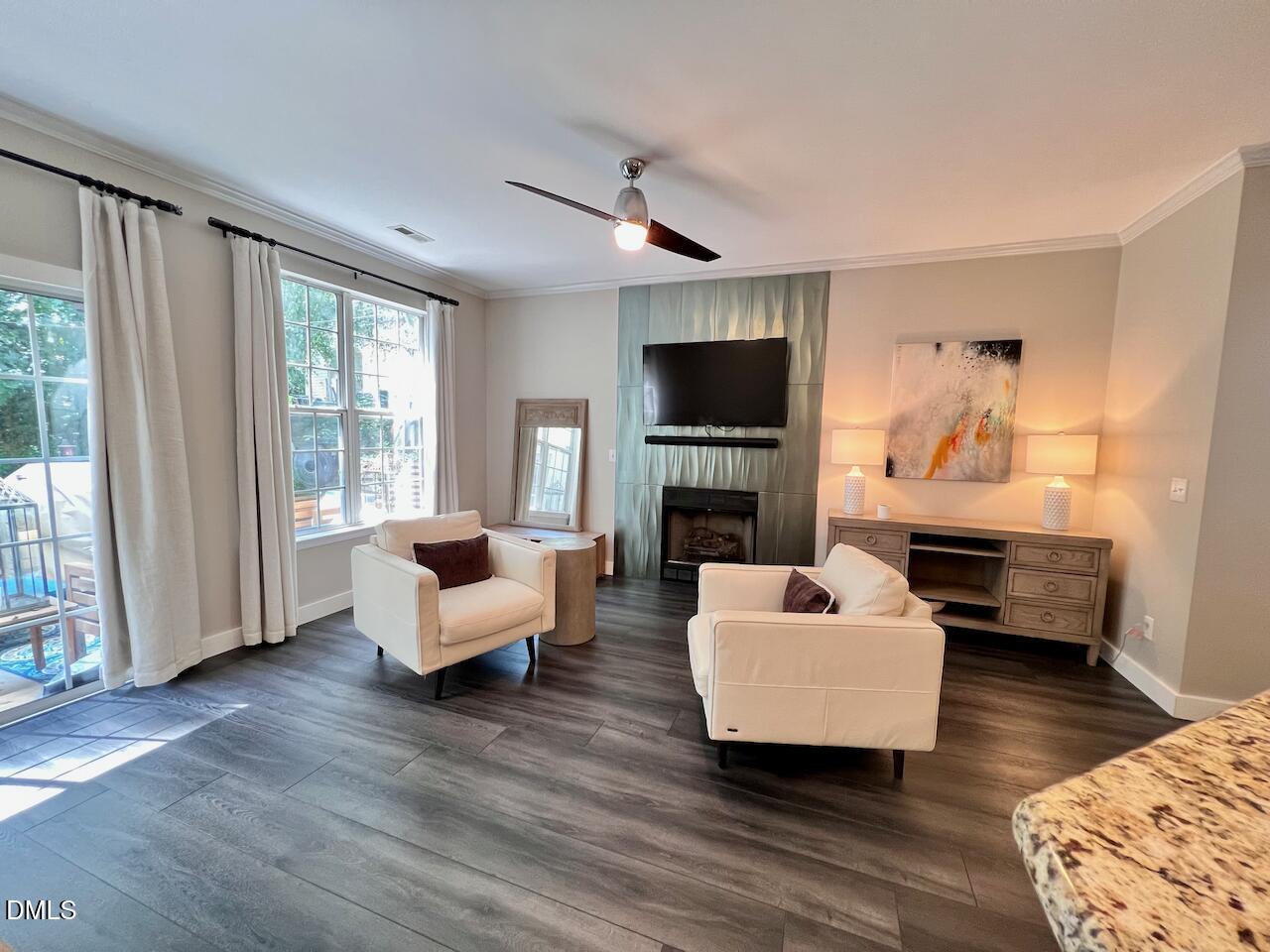 1941 Lost Lane Raleigh, NC 27603 - Photo 6 of 25 a living room with furniture and a flat screen tv