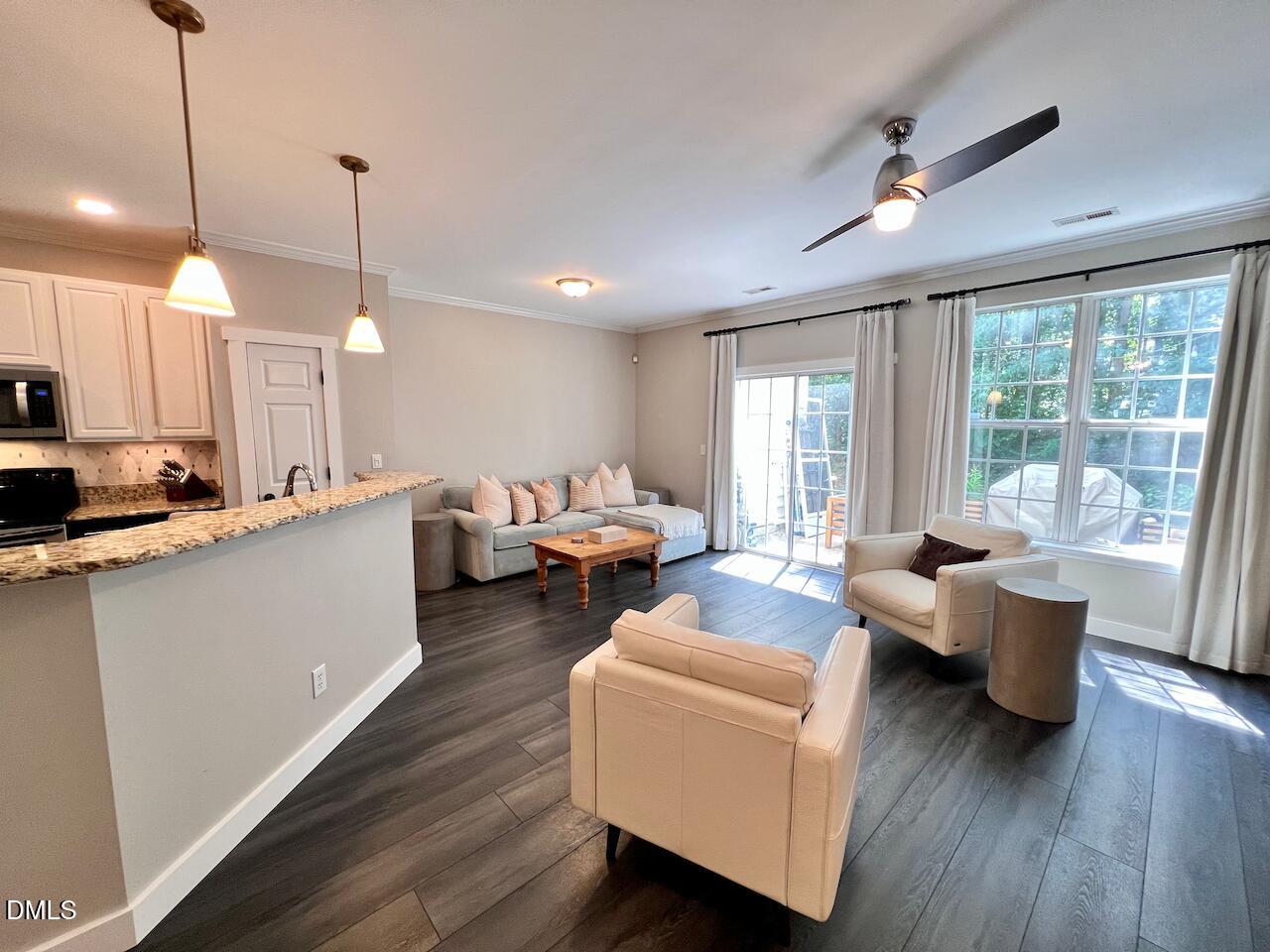 1941 Lost Lane Raleigh, NC 27603 - Photo 7 of 25 a living room with furniture and a large window
