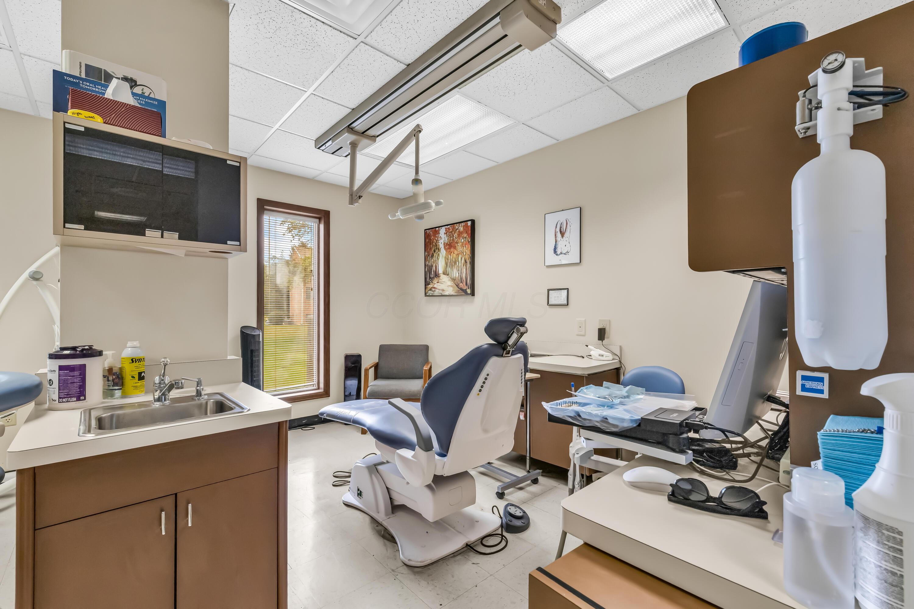 1240 Crescent Heights Road Marion, OH 43302 - Photo 40 of 60 • Neutral vinyl flooring • Ivory painted walls • Acoustic ceiling tiles • Fluorescent lighting • Enclosed vanity with single bowl, stainless steel sinktop • Divider • Lighting & equipment do not remain • Plumbed for oxygen & nitrogen