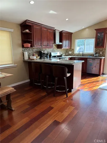 a kitchen with a sink cabinets and window