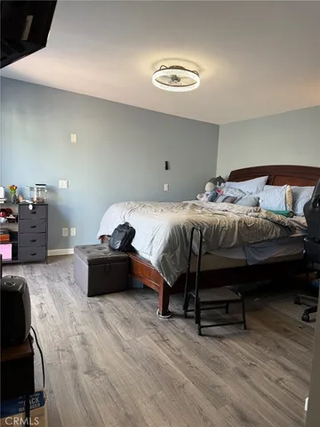 a bedroom with furniture and a bed