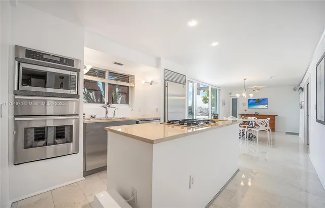 a kitchen with a stove and a microwave