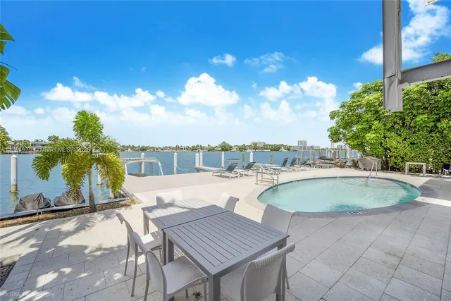 a view of a swimming pool with a patio