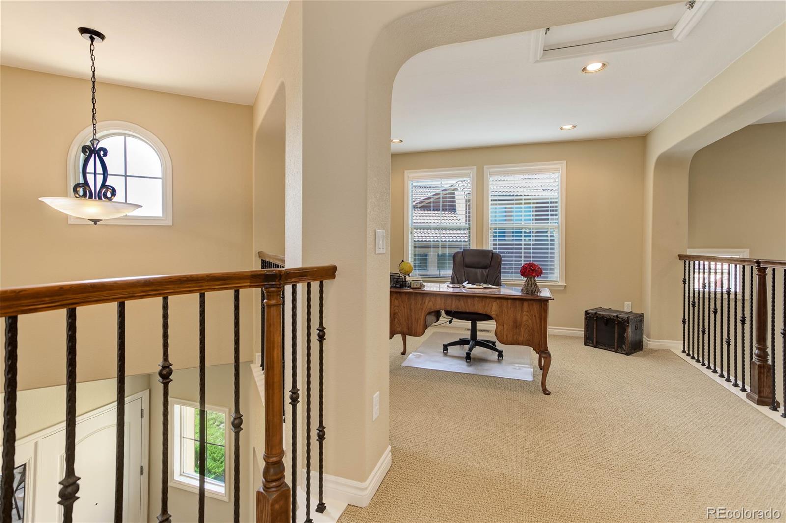 9285 Viaggio Way Highlands Ranch, CO 80126 - Photo 20 of 45 a view of a room with workspace and windows