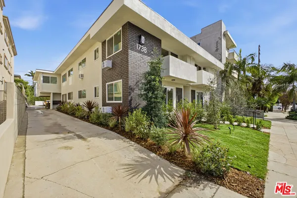 a front view of a building with garden