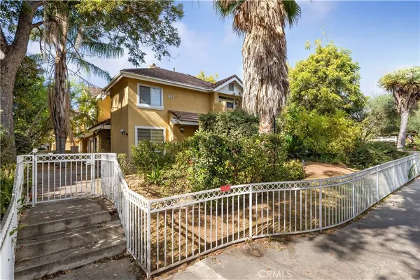 a view of a wrought iron fences in front of house