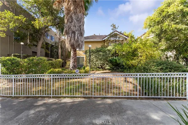 a view of a wrought iron fences in front of house