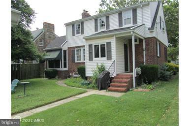 3009 Dunran Road Dundalk, MD 21222 - Photo 22 of 26 a front view of a house with a yard