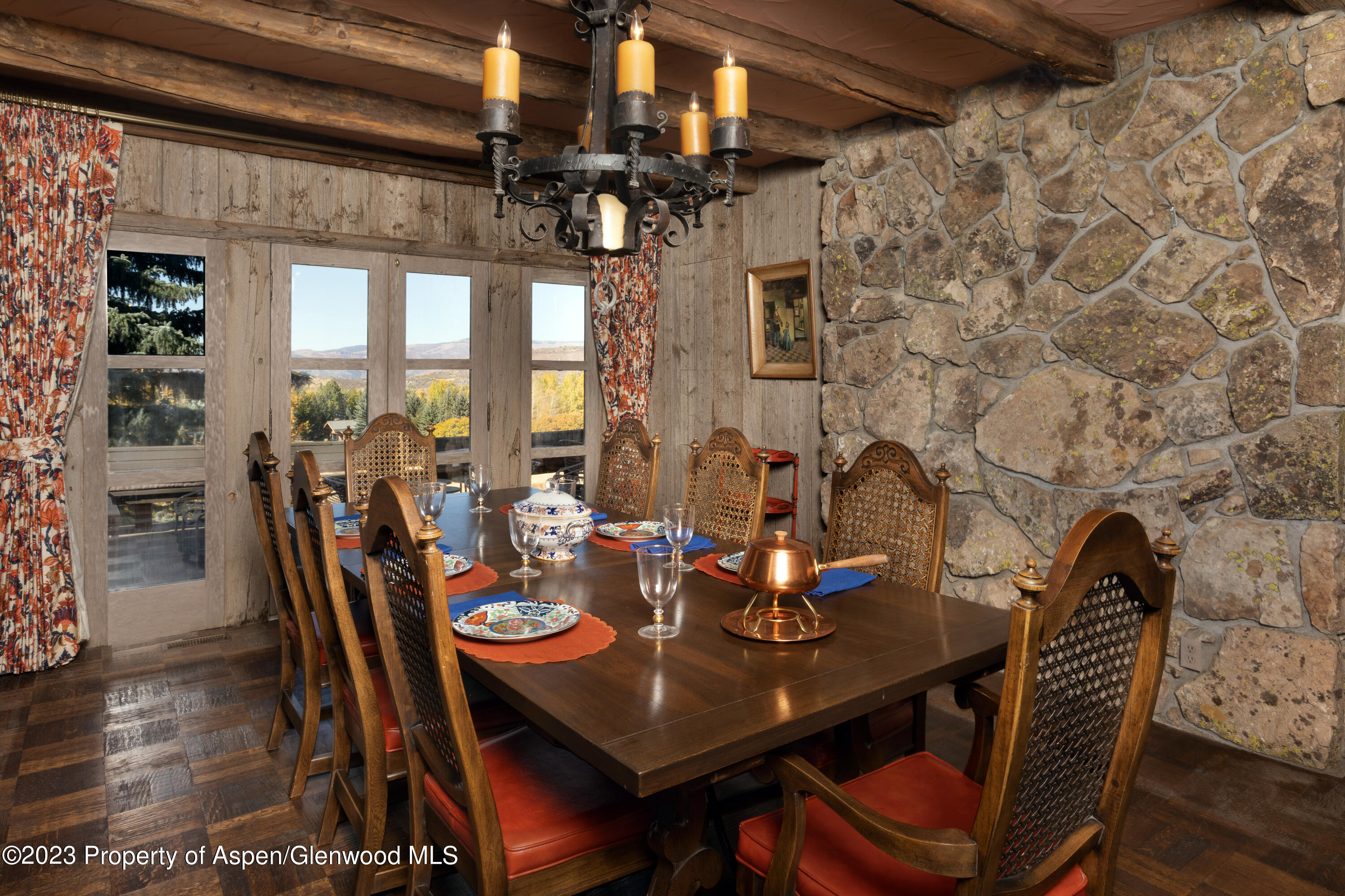 137 Primrose Path Aspen, CO 81611 - Photo 23 of 46 a view of a dining room with furniture window and wooden floor