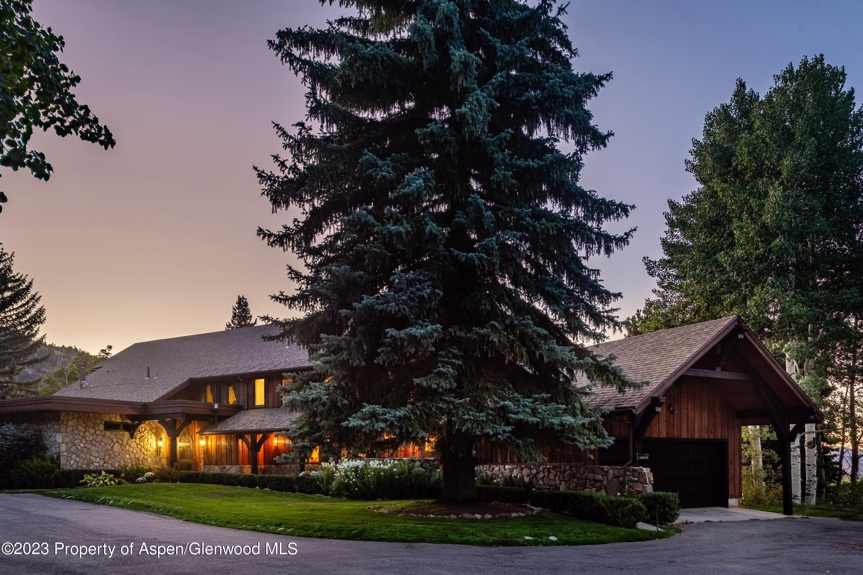 137 Primrose Path Aspen, CO 81611 - Photo 3 of 46 a front view of a house with a yard and green space