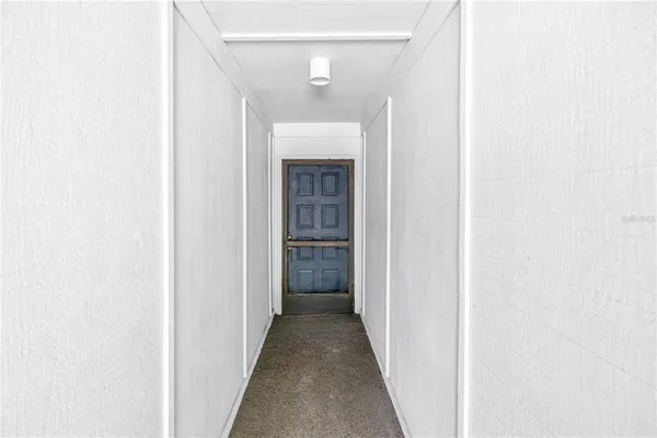 a view of a hallway with stairs